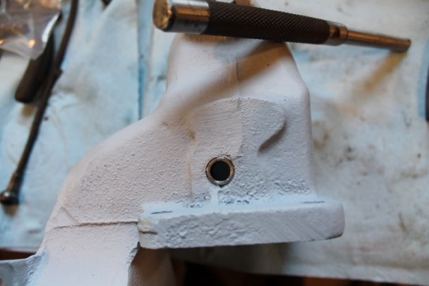 Manifold heat riser bushings in